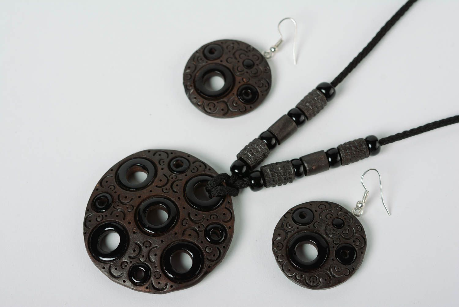 A set of handcrafted black ceramic earrings and necklace made of clay with colored enamel paintings photo 2