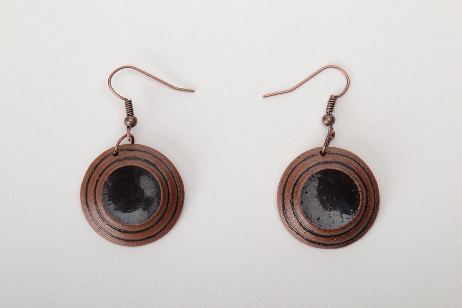 Handmade brown ceramic dangle earrings of round shape painted with enamels photo 3