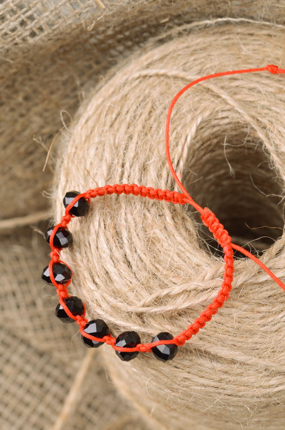 Handmade woven thread bracelet with beads of orange color and universal size photo 1