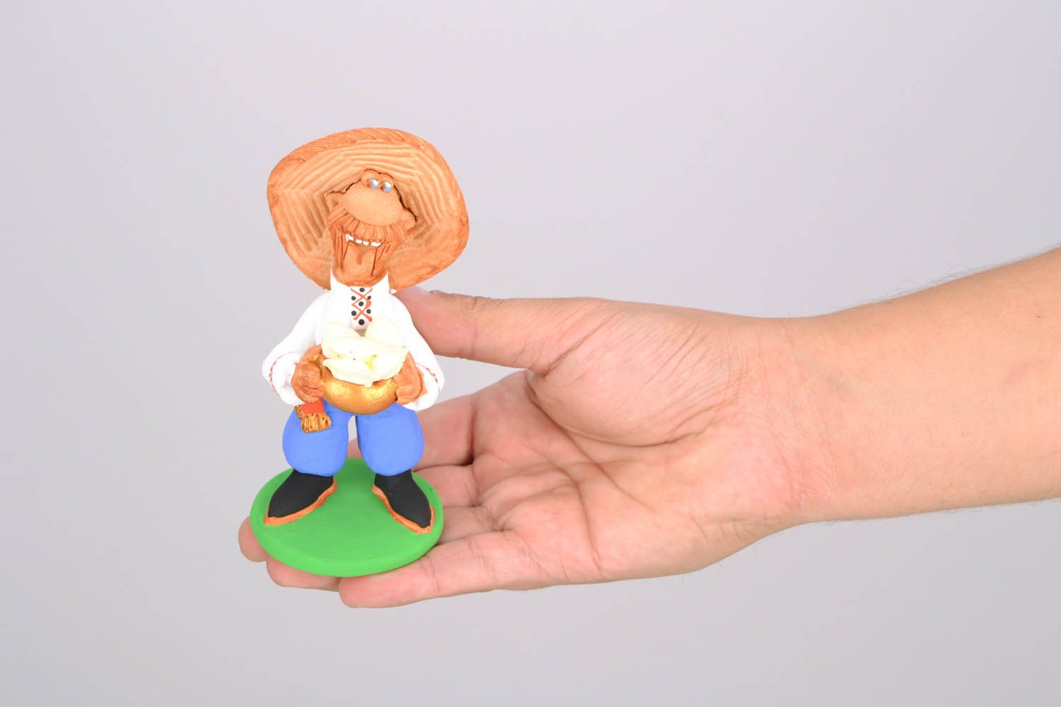 Clay handmade figurine Cossack with dumplings  photo 2
