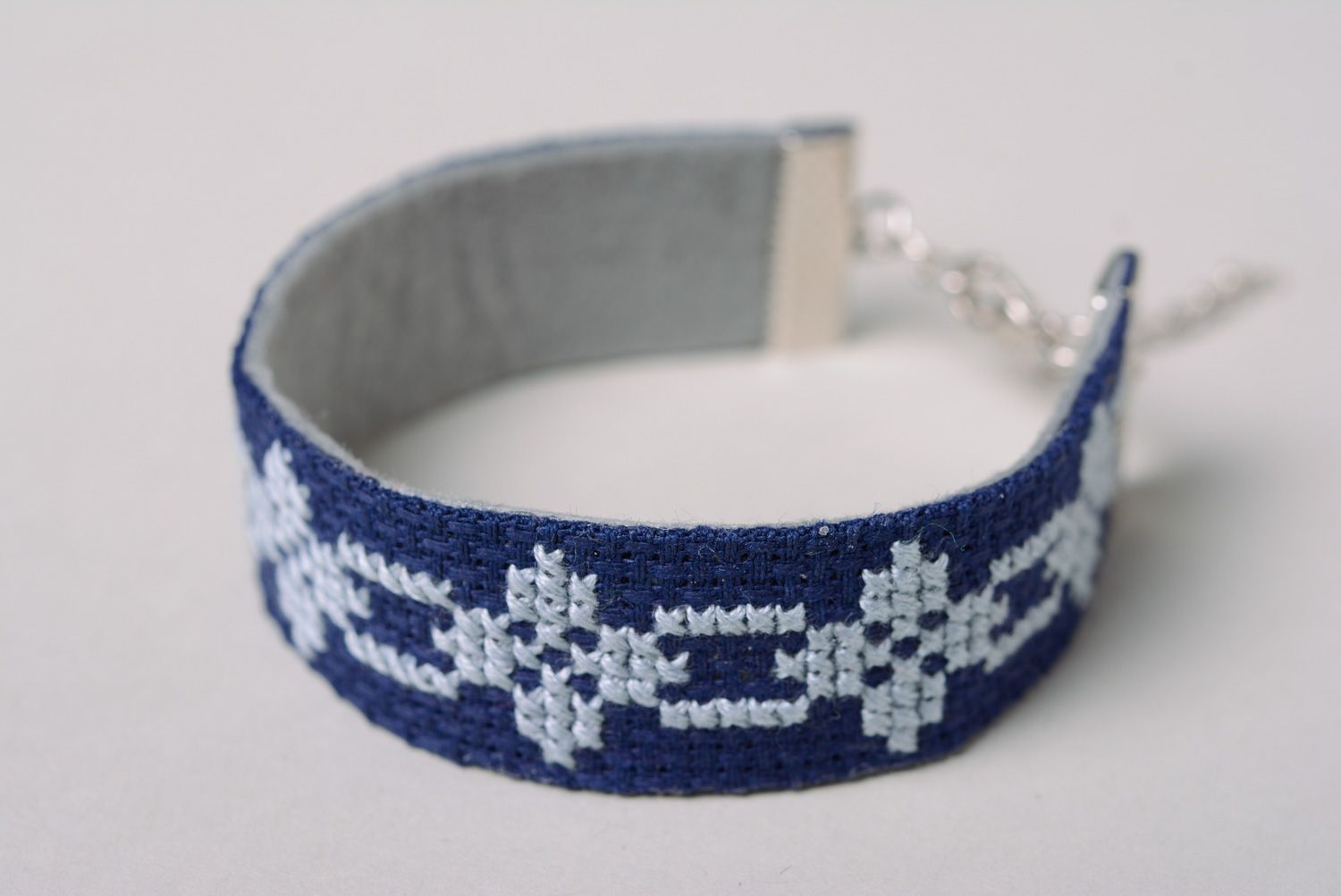Handmade women's wrist embroidered bracelet in ethnic style in blue color palette  photo 2