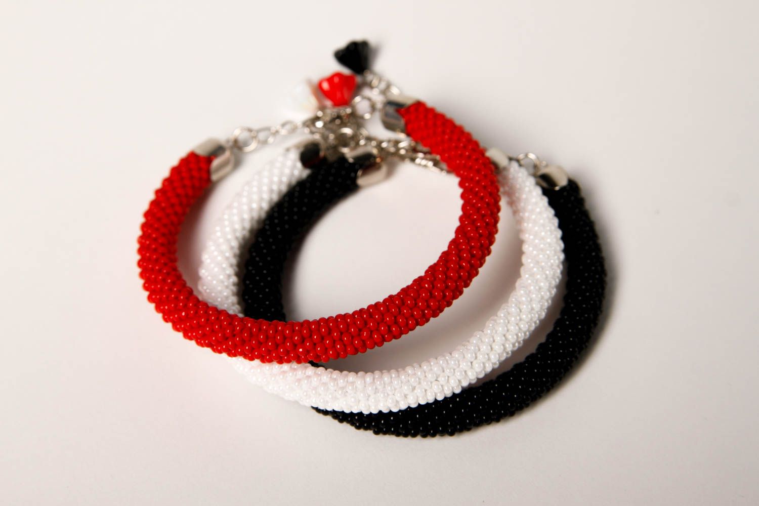 Handmade three-row beaded cord bracelet in black, red, and white colors photo 3