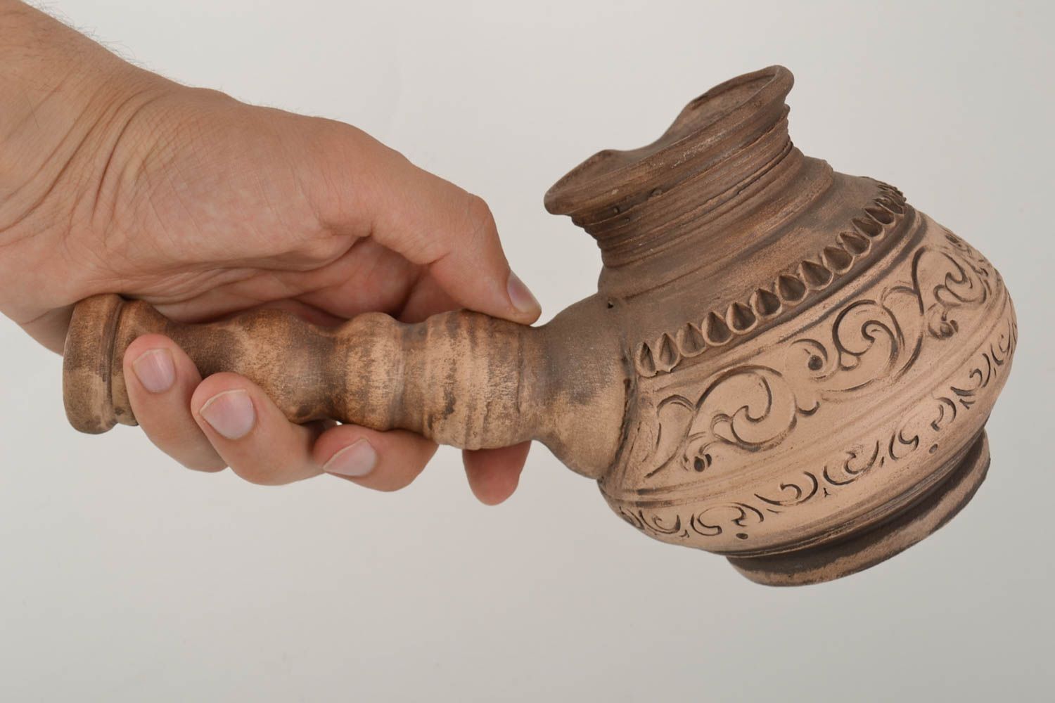 Ceramic unusual brown handmade ibrik with ornaments with bulk of 500 ml photo 2