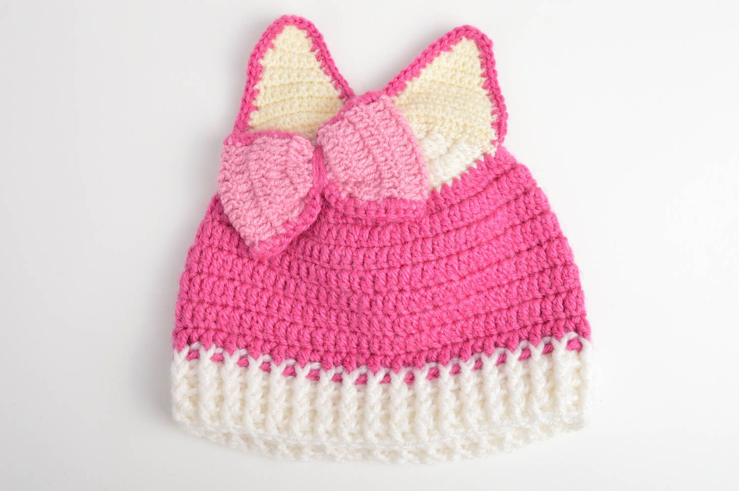 Розовая вязанная шапка для ребенка из шерсти и акрила ручной работы фото 3