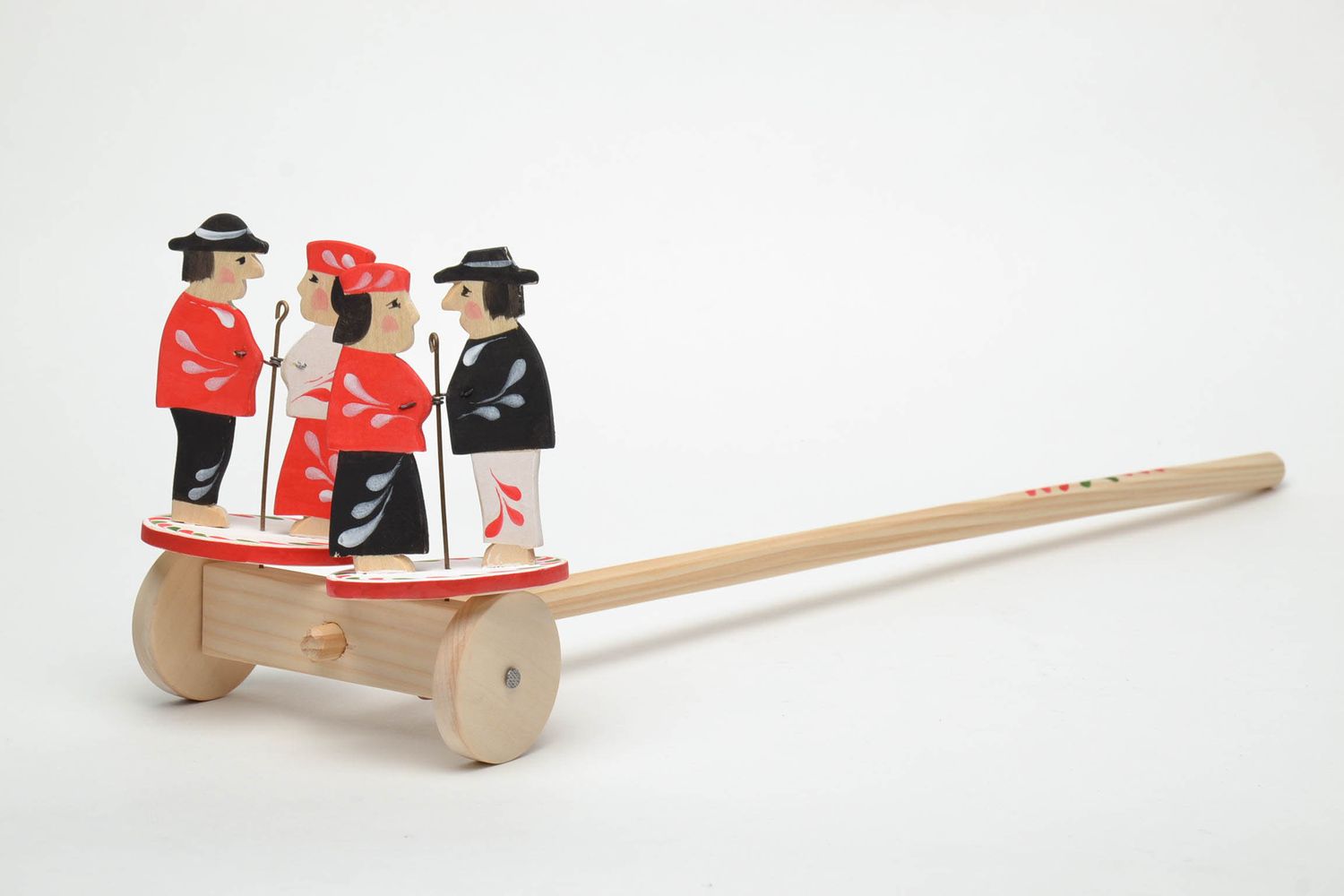 Handmade wooden wheeled toy with ethnic painting photo 2