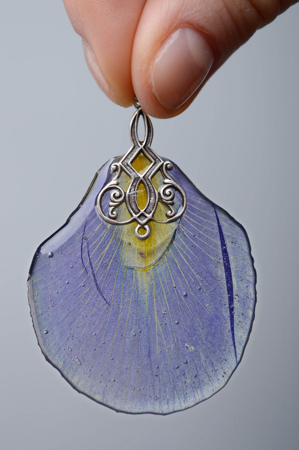 Women's neck pendant with iris petal embedded in epoxy resin photo 3