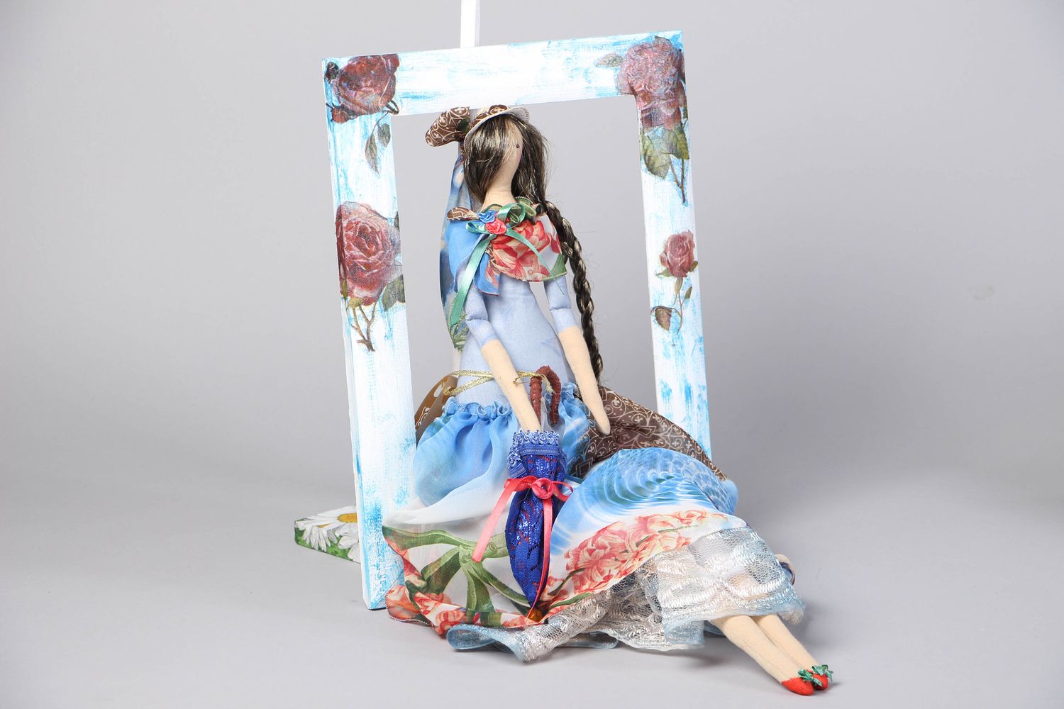 Fabric doll in frame with stand photo 1