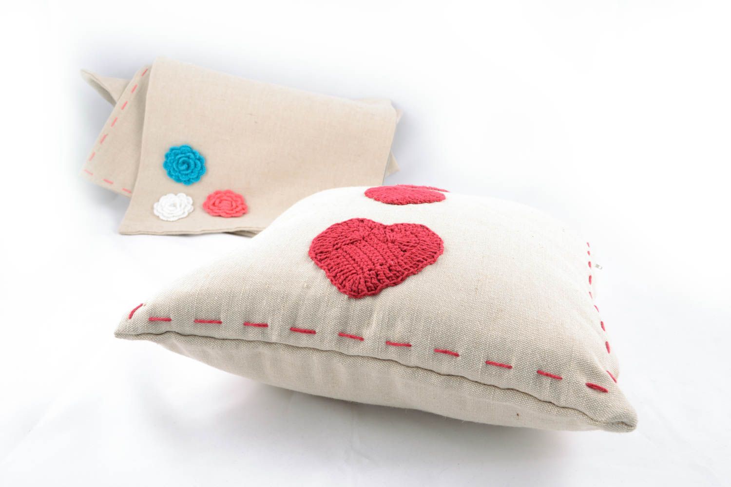 Soft cushion with crochet hearts photo 4