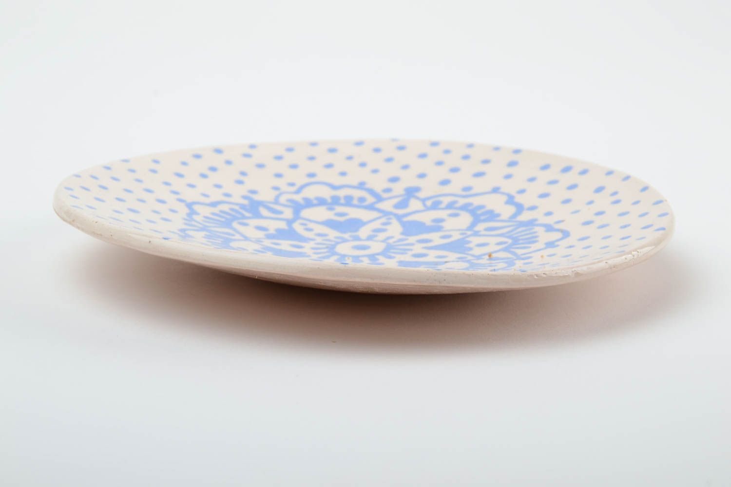Handmade decorative small glazed white ceramic saucer with blue ornaments photo 4