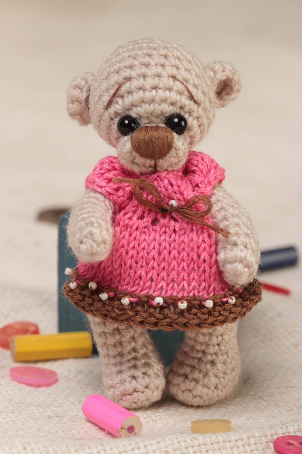 Handmade small soft crocheted toy beige bear girl in pink dress for children photo 1