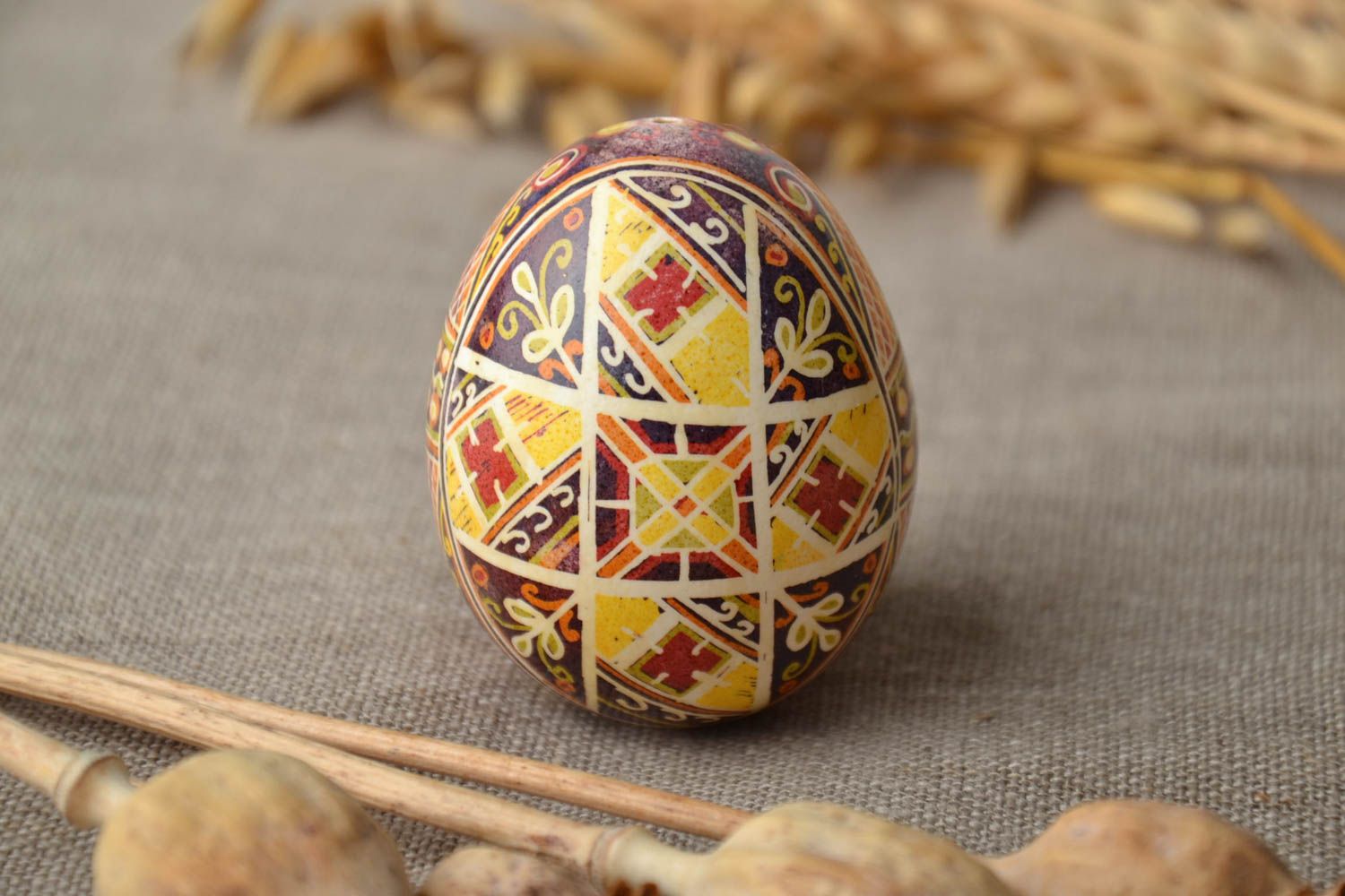 Painted egg with traditional symbolics photo 1