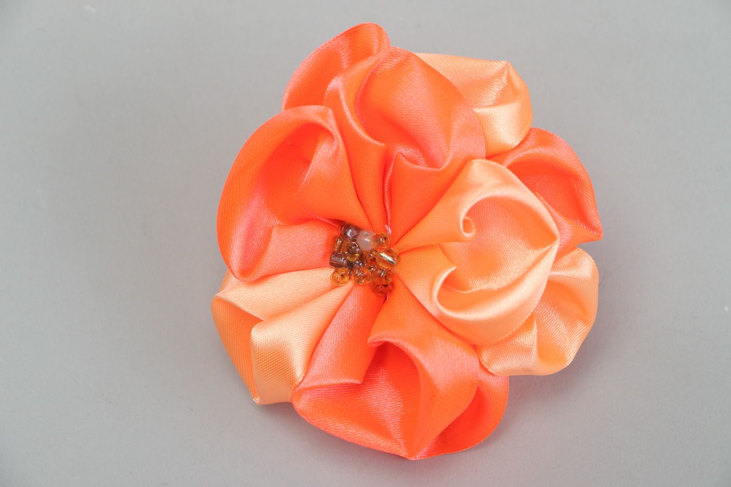 Handmade hair tie with volume flower of peach color sewn of satin fabric  photo 2