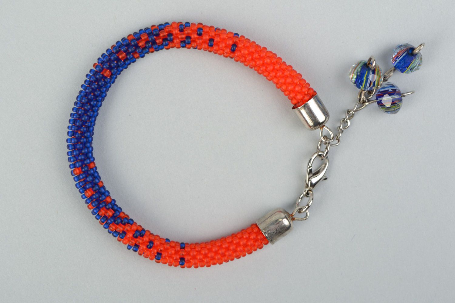 Handmade cord bracelet woven of bright red and blue Czech beads for women photo 2