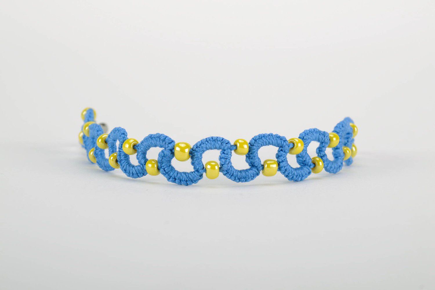 Blue bracelet woven from threads photo 1