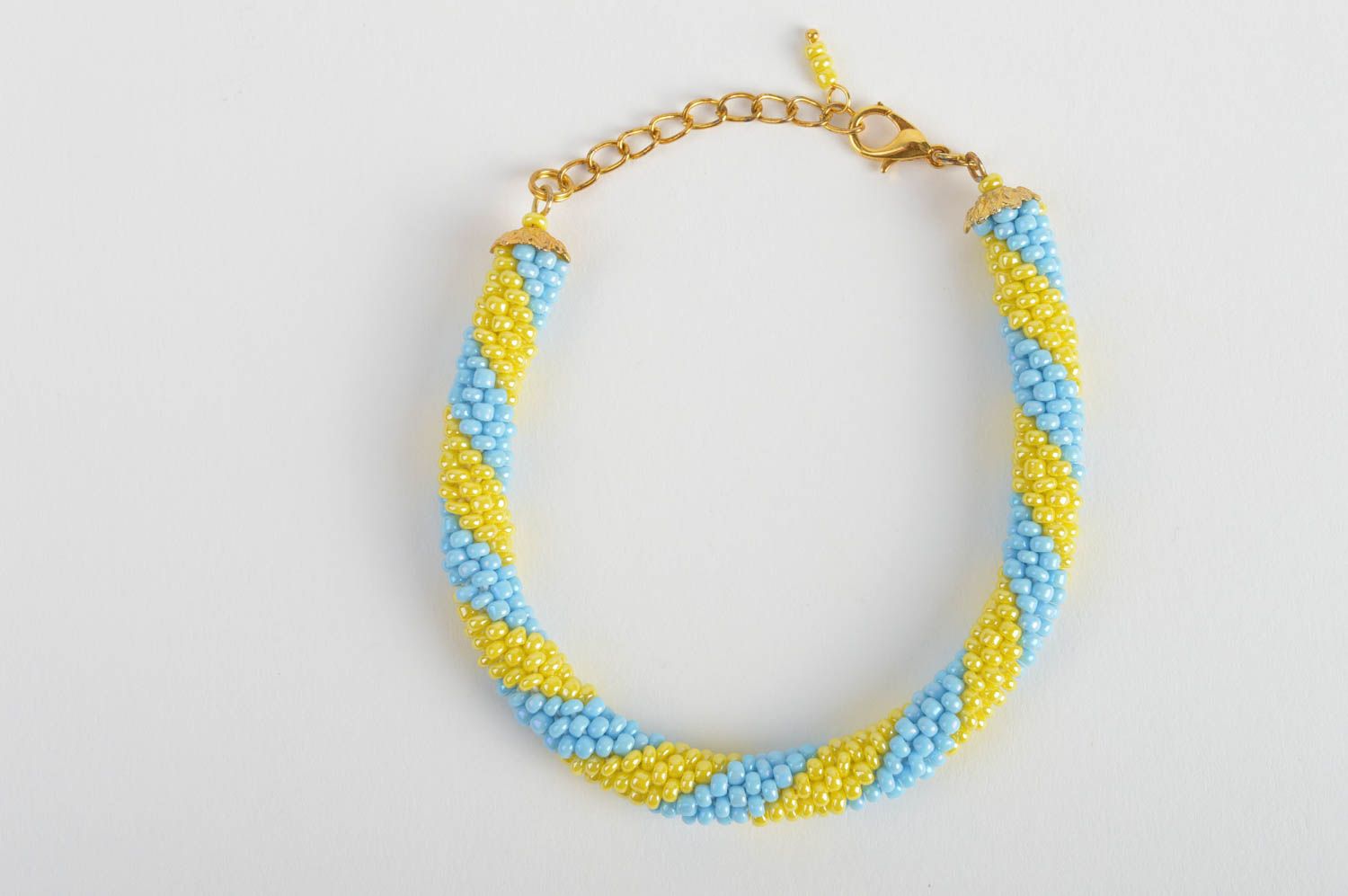 Handmade beaded cord wrist bracelet in blue and yellow colors for women photo 2