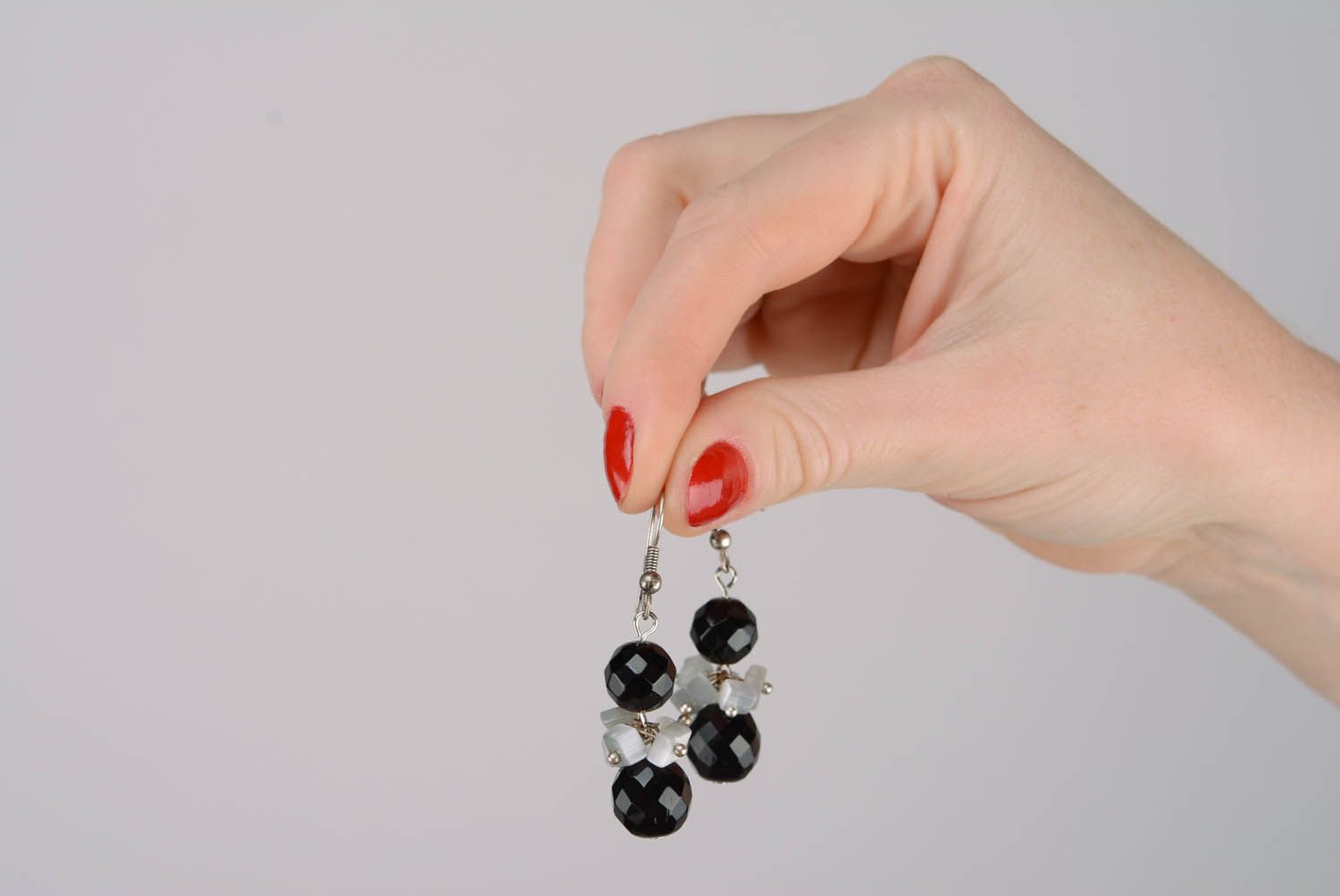 Metal earrings with black crystal photo 2