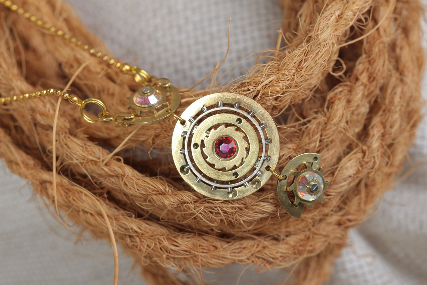 Handmade round steampunk pendant with rhinestones and clock mechanism details photo 1
