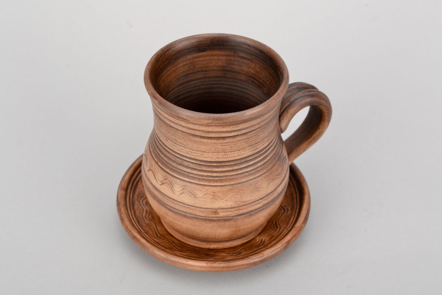 4 oz clay glazed drinking cup in pitcher shape with handle and rustic pattern photo 3