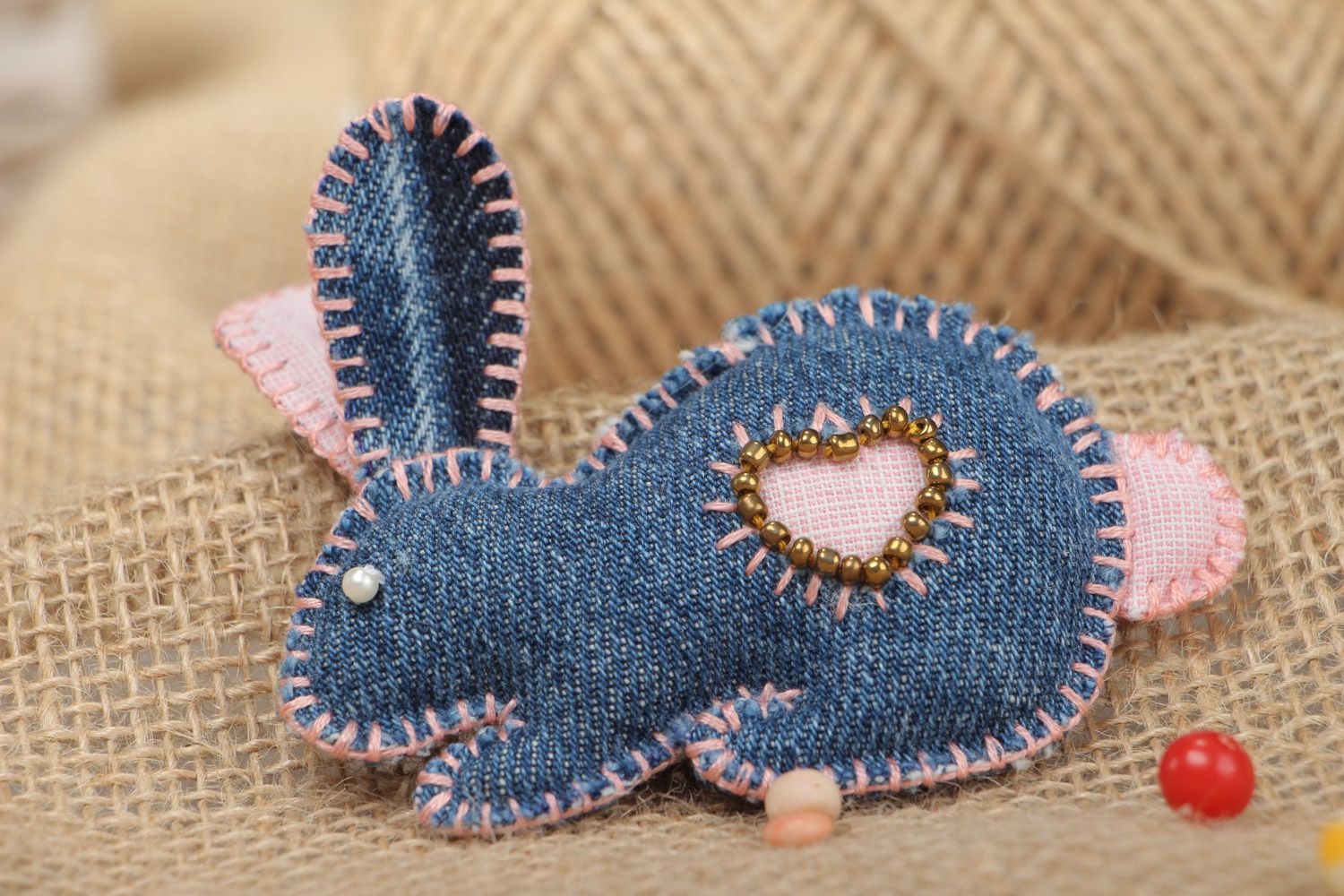Small handmade decorative soft toy in sewn of denim fabric in the shape of rabbit photo 1