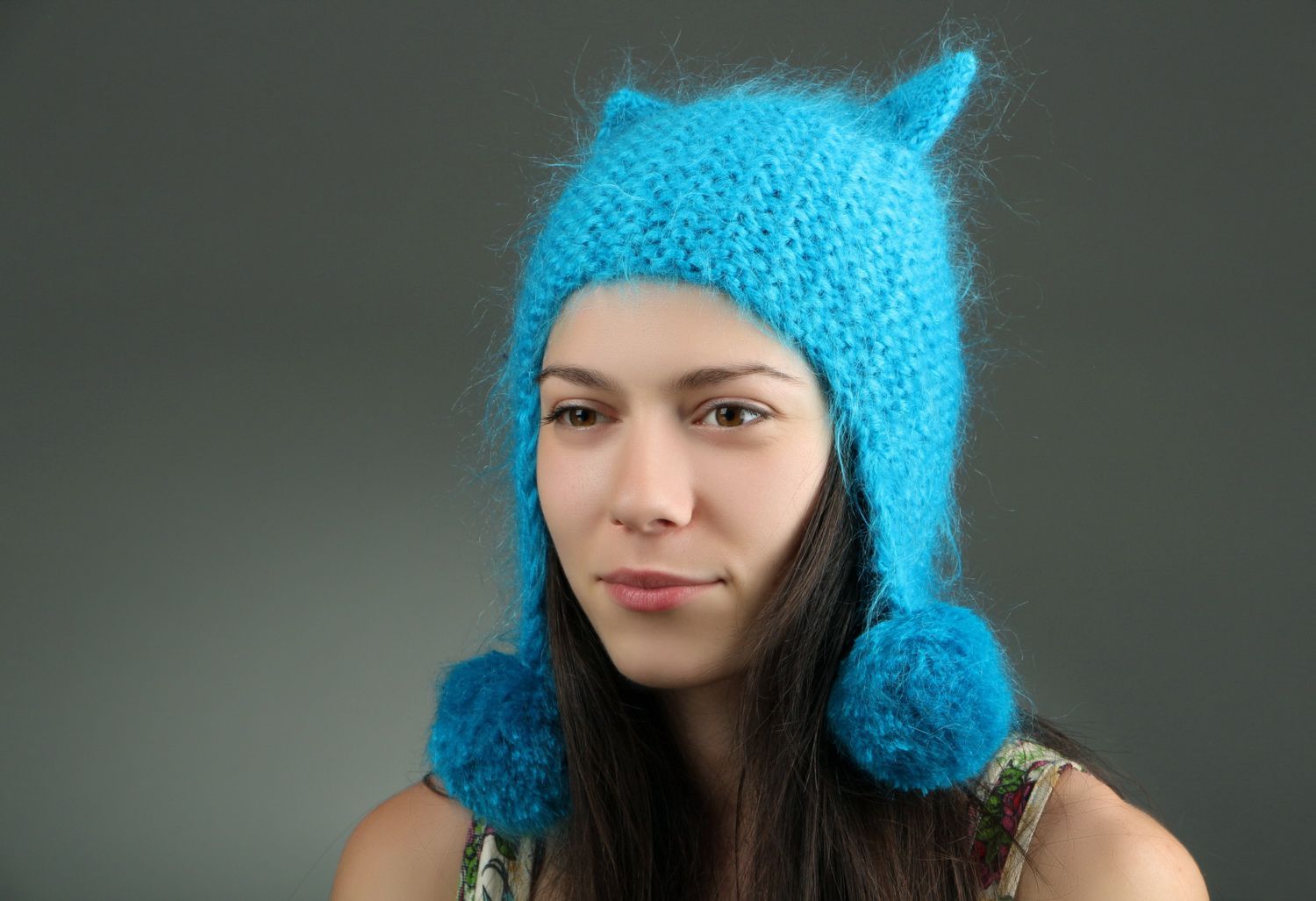 Blue knitted hat with pom-poms photo 1