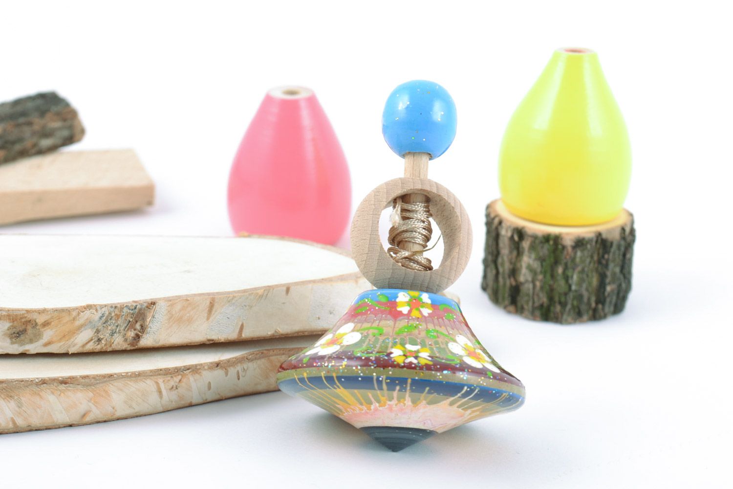 Painted handmade wooden spinning top toy for child made of natural materials photo 1