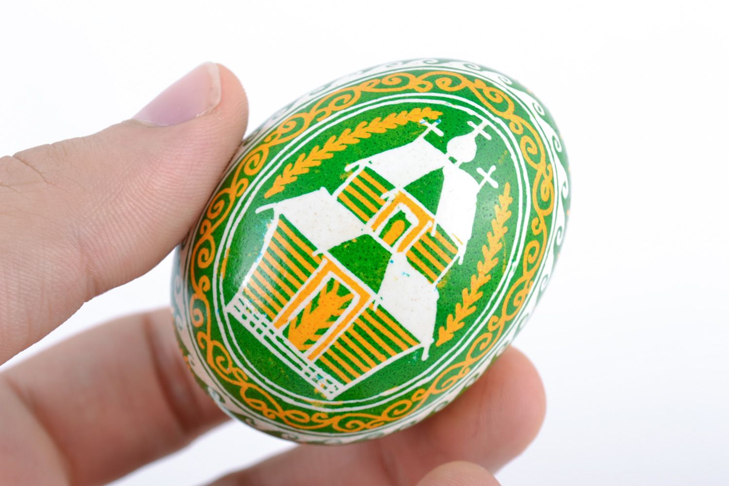 Yellow and green handmade bright painted Easter chicken egg with patterns photo 2