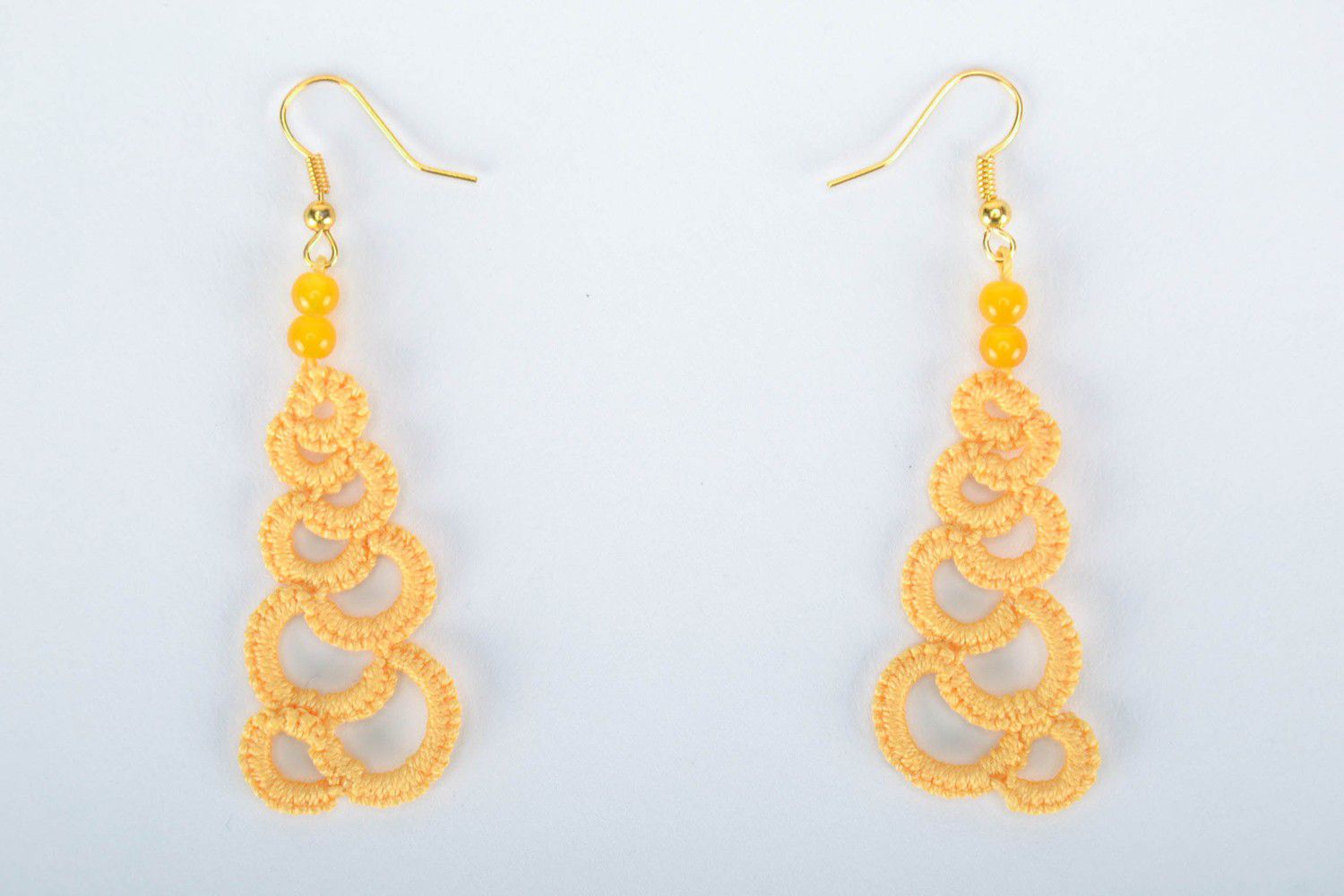 Orange earrings made from woven lace photo 3