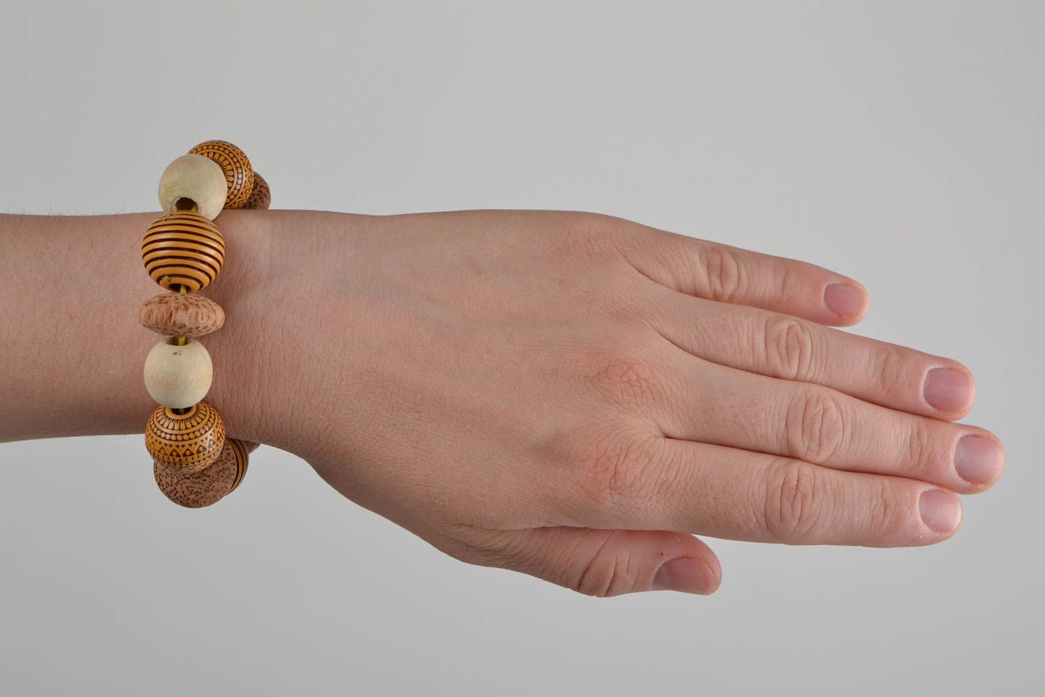 Handmade designer women's wooden and plastic beaded wrist stretch bracelet  photo 3
