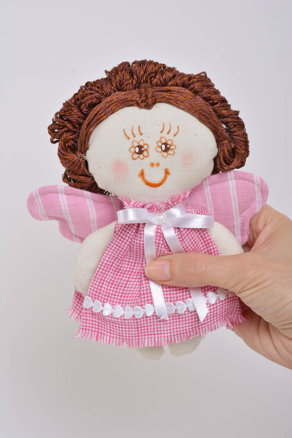 Handmade soft toy sewn of cotton fabric in the shape of angel girl in pink dress photo 4