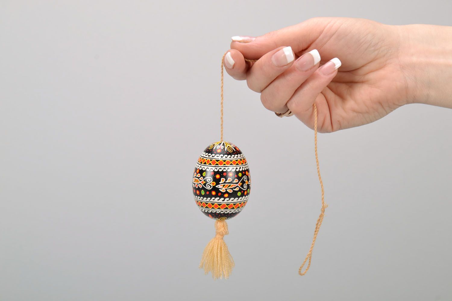 Painted egg with a tassel photo 2
