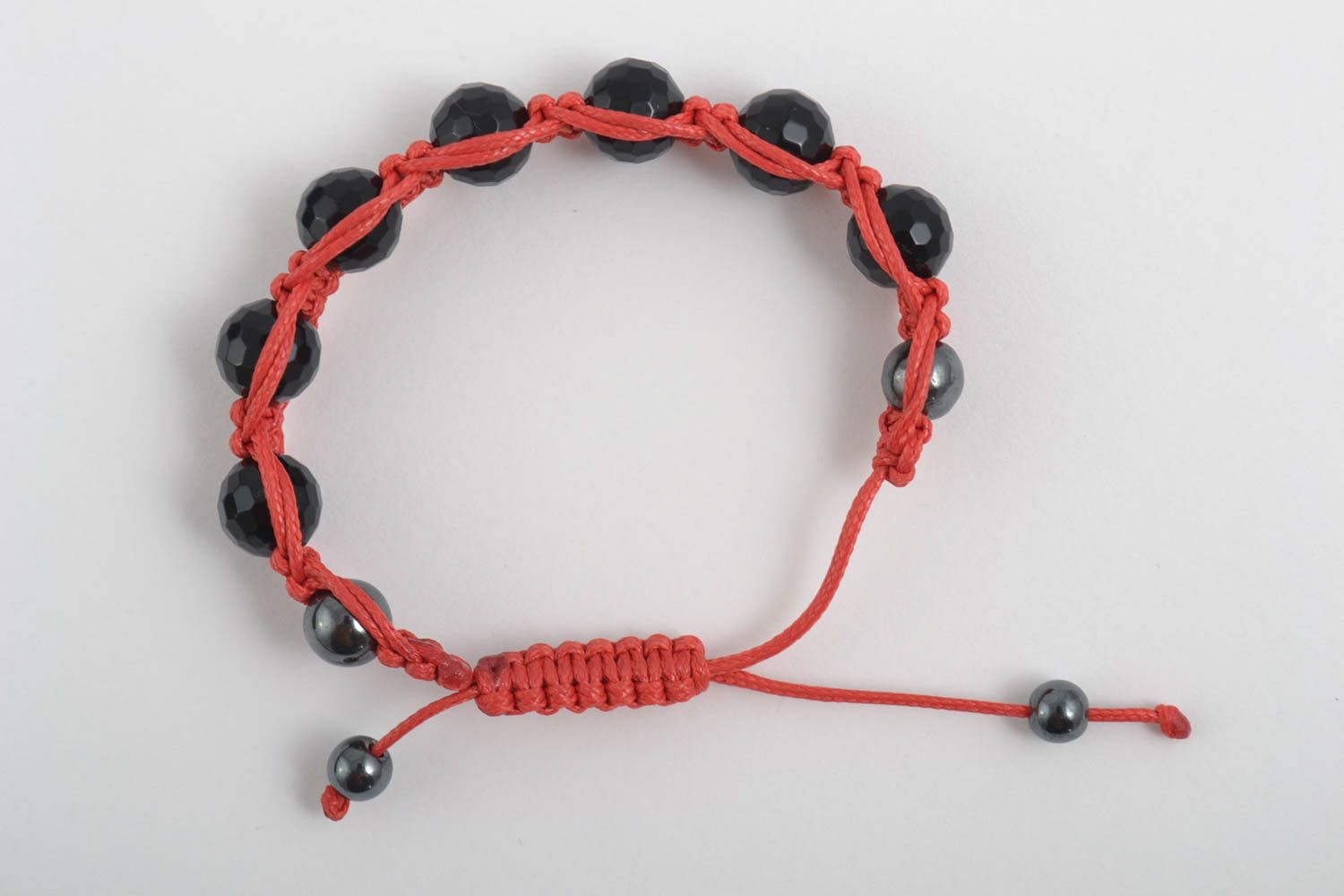 Black beads strand bracelet gemstone jewelry on red card photo 2