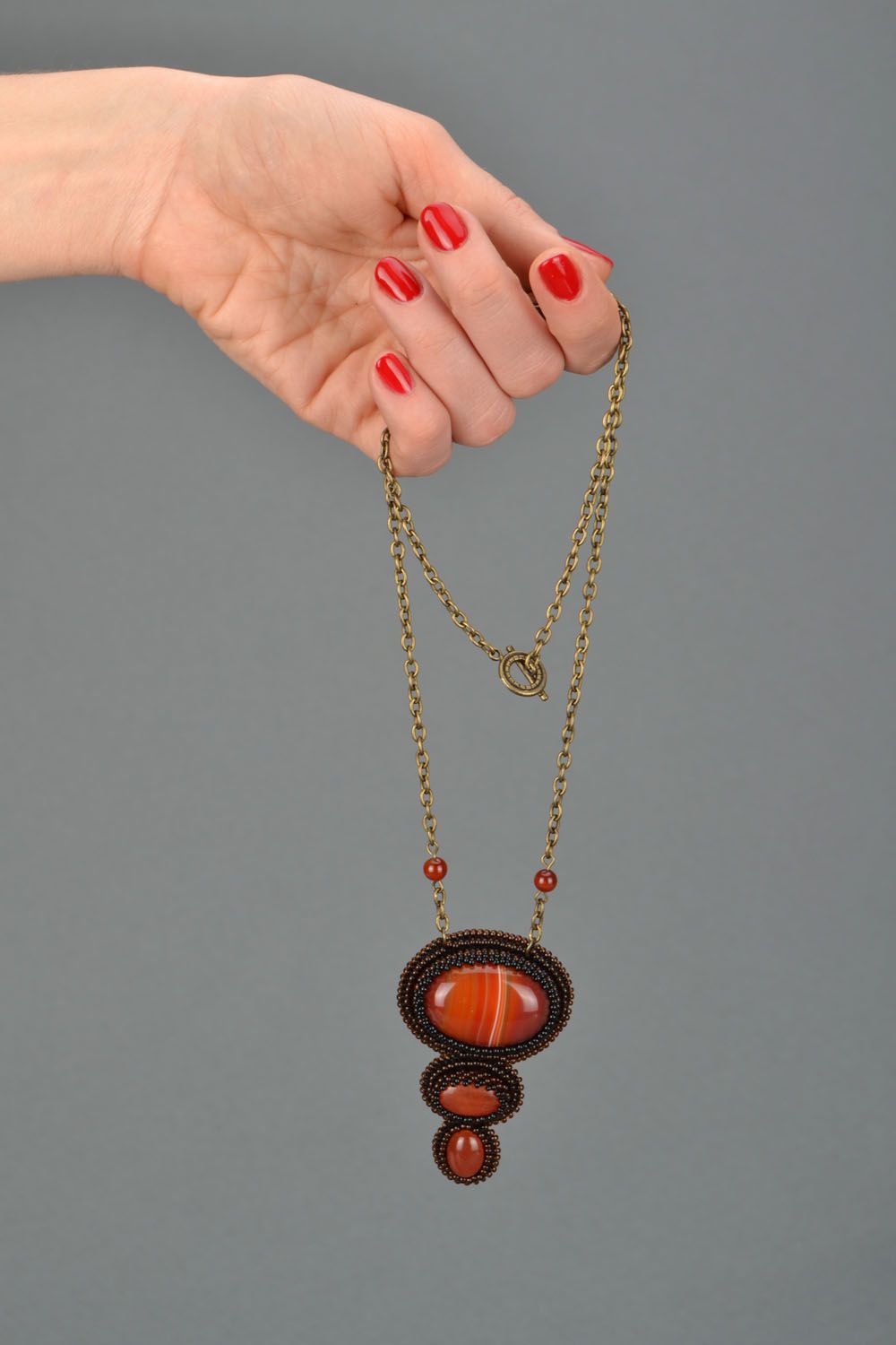 Handmade pendant with cornelian stone photo 2