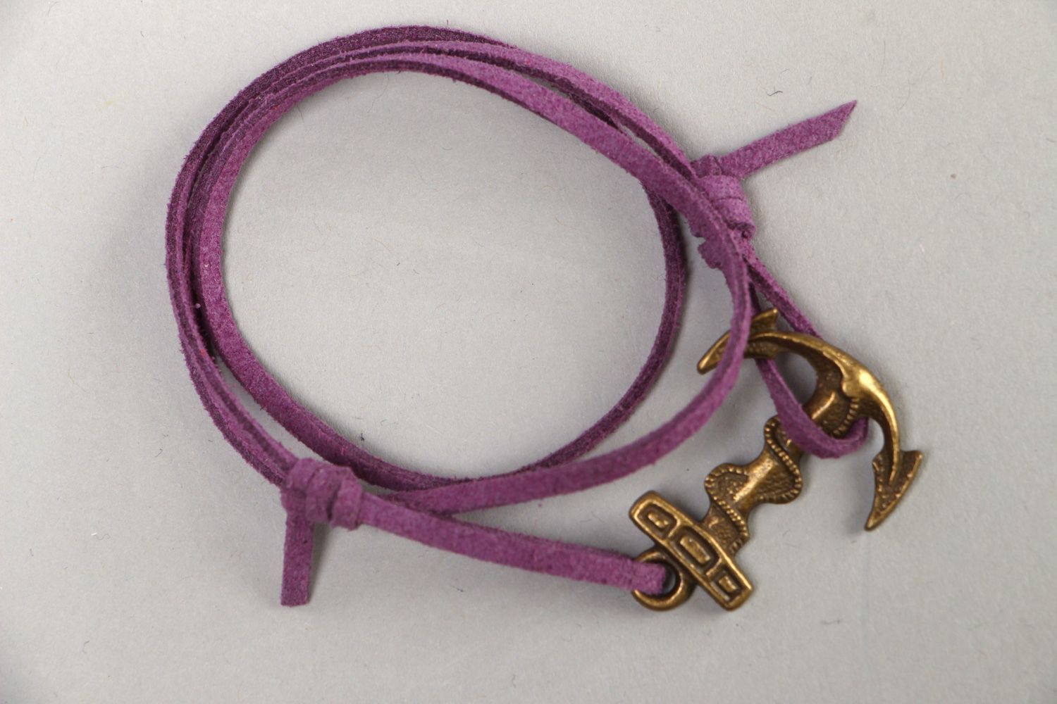Handmade faux suede wrist bracelet of violet color with metal charm Marine photo 1
