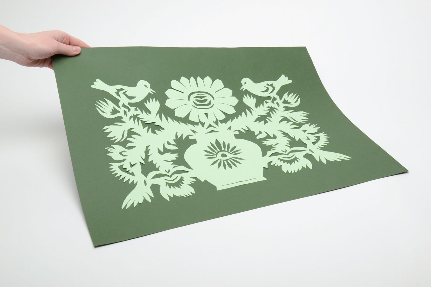 Paper cut out picture on green background Blackthorn photo 5