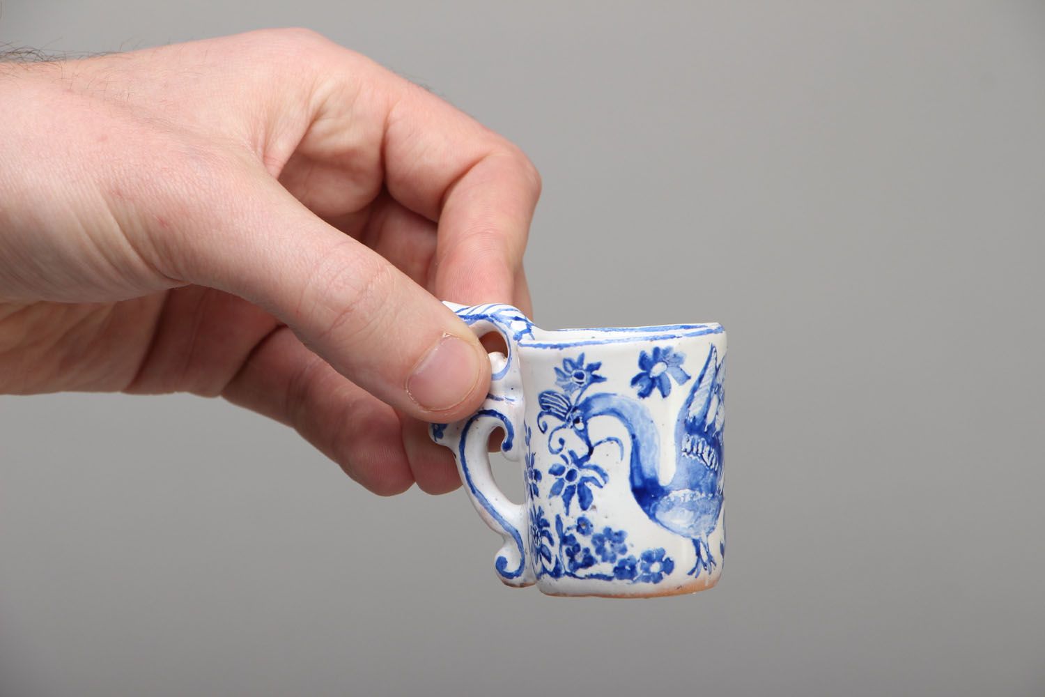 Miniature ceramic glazed cup with elegant handle for table decor photo 4