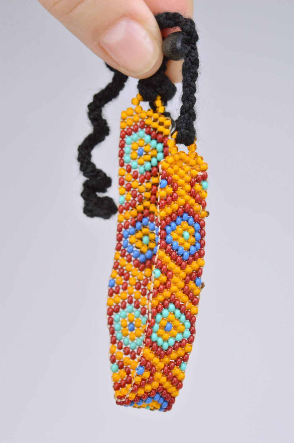 Handmade orange wrist bracelet woven of Czech beads with geometric ornament photo 3