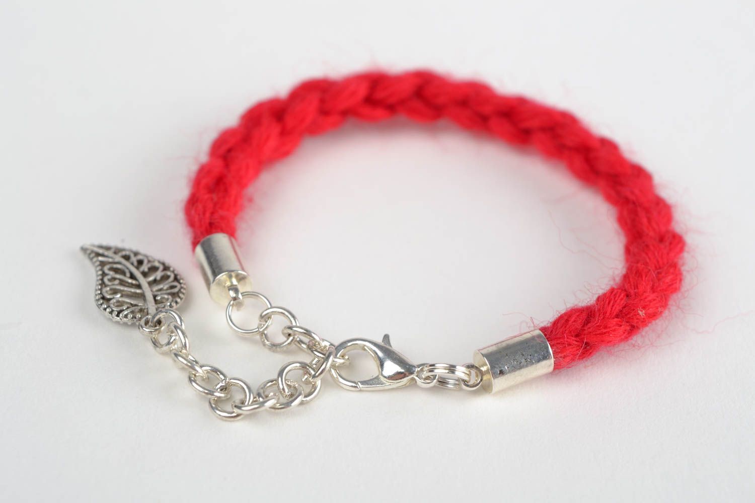 Handmade thin  wrist bracelet woven of red woolen threads with metal leaf charm  photo 4