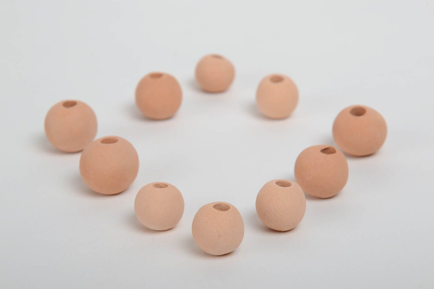 Set of 10 small handmade beige ceramic beads with smooth surface photo 2