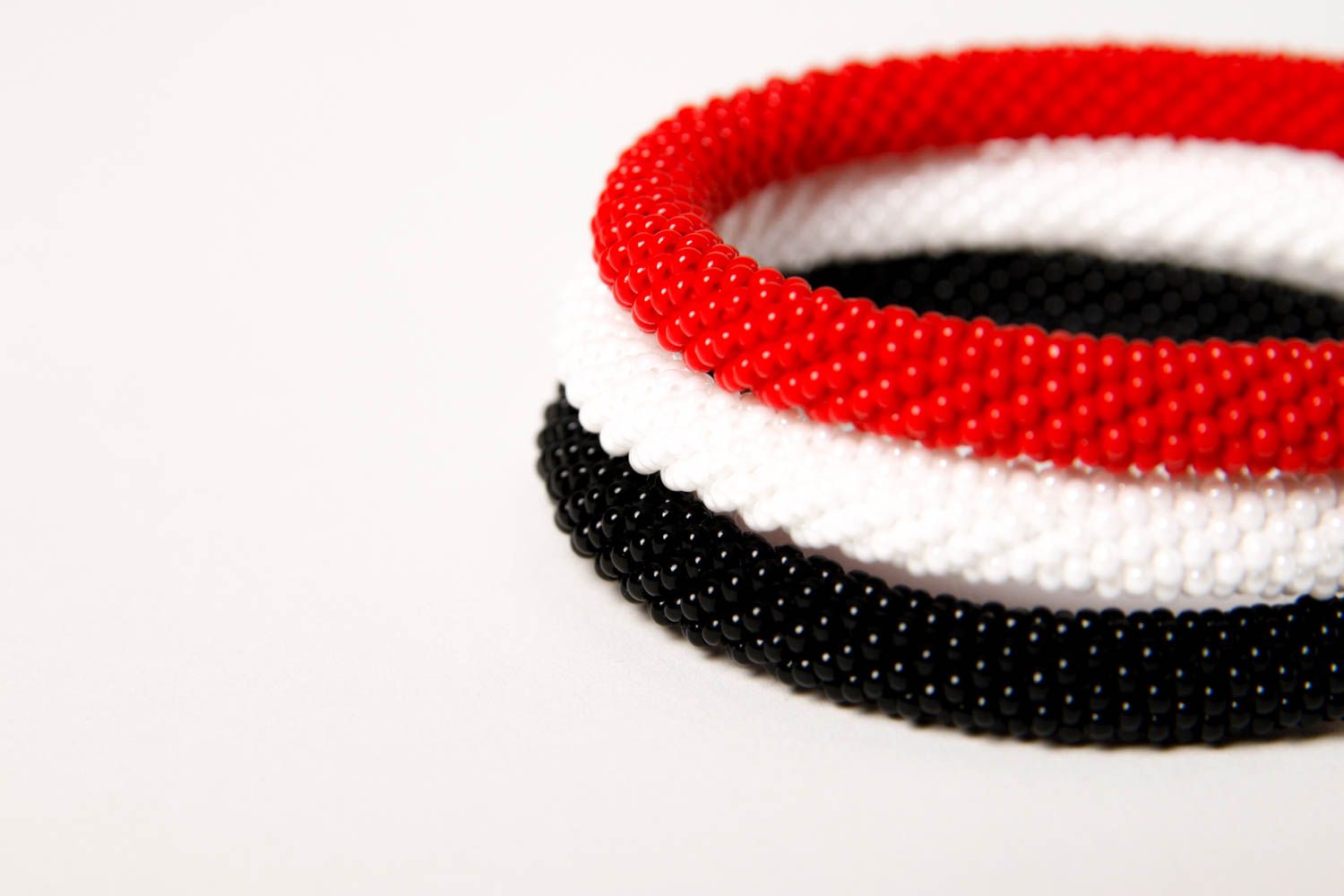 Handmade three-row beaded cord bracelet in black, red, and white colors photo 5