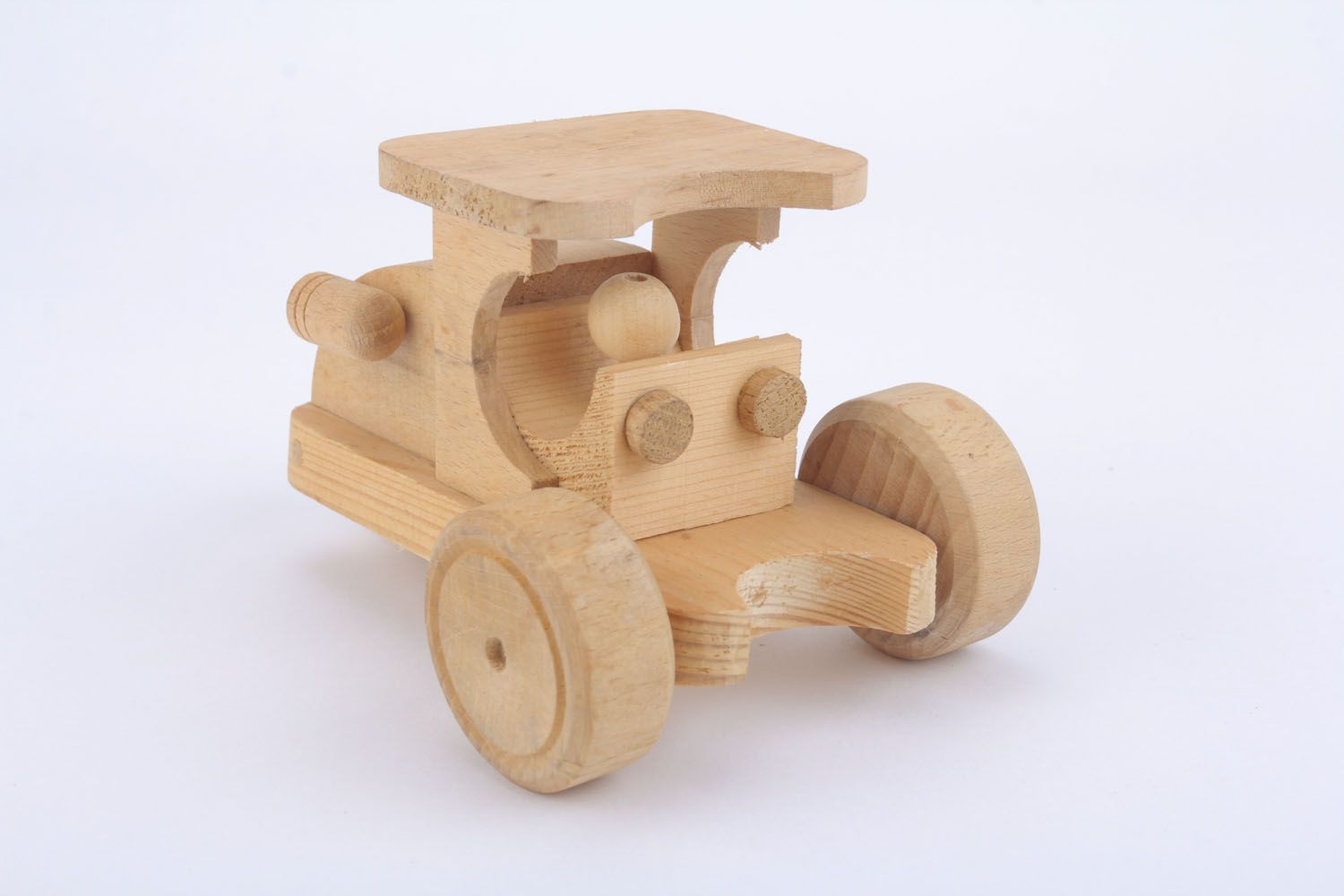 Trattore giocattolo fatto a mano giocattolo di legno semilavorato da dipingere foto 3