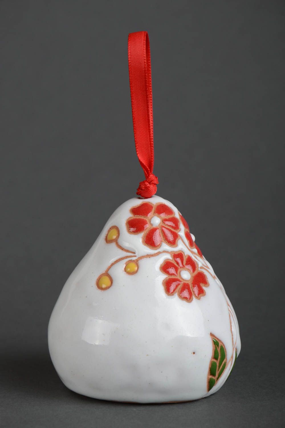 Handmade decorative pottery ceramic white bell with red flowers on red ribbon photo 2