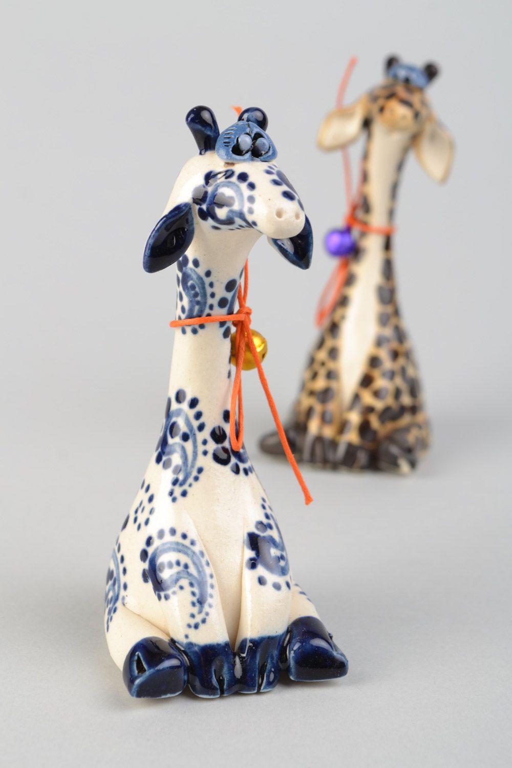 Handmade small ceramic figurine of giraffe painted with white and blue glaze photo 1