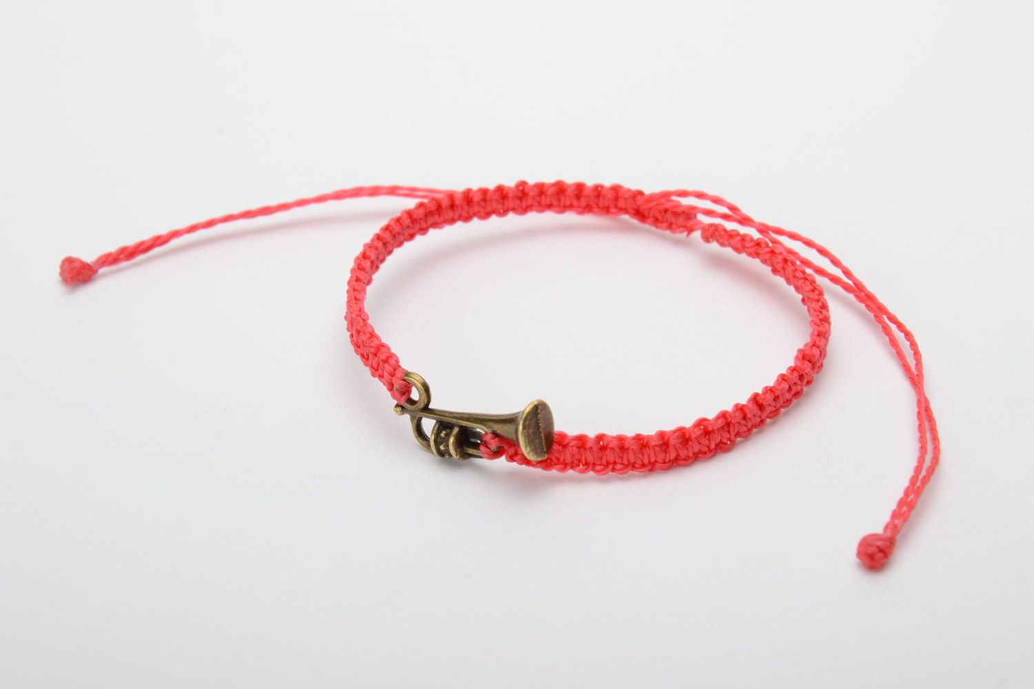 Handmade red woven capron thread bracelet with metal charm in the shape of saxophone photo 3