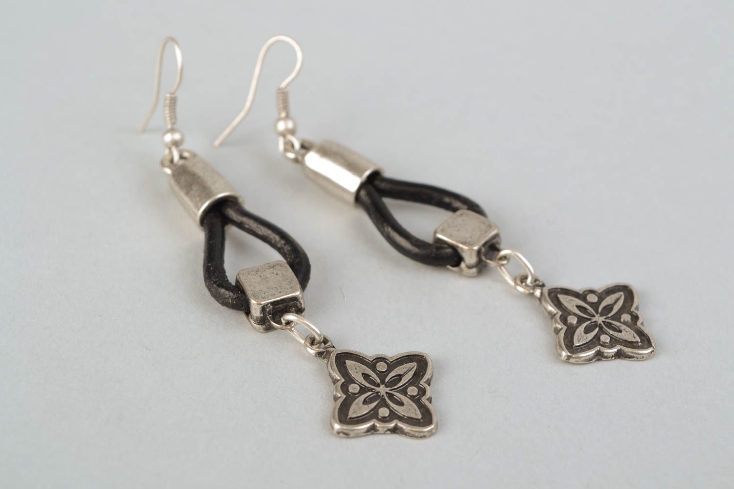 Long metal earrings with leather inserts photo 4