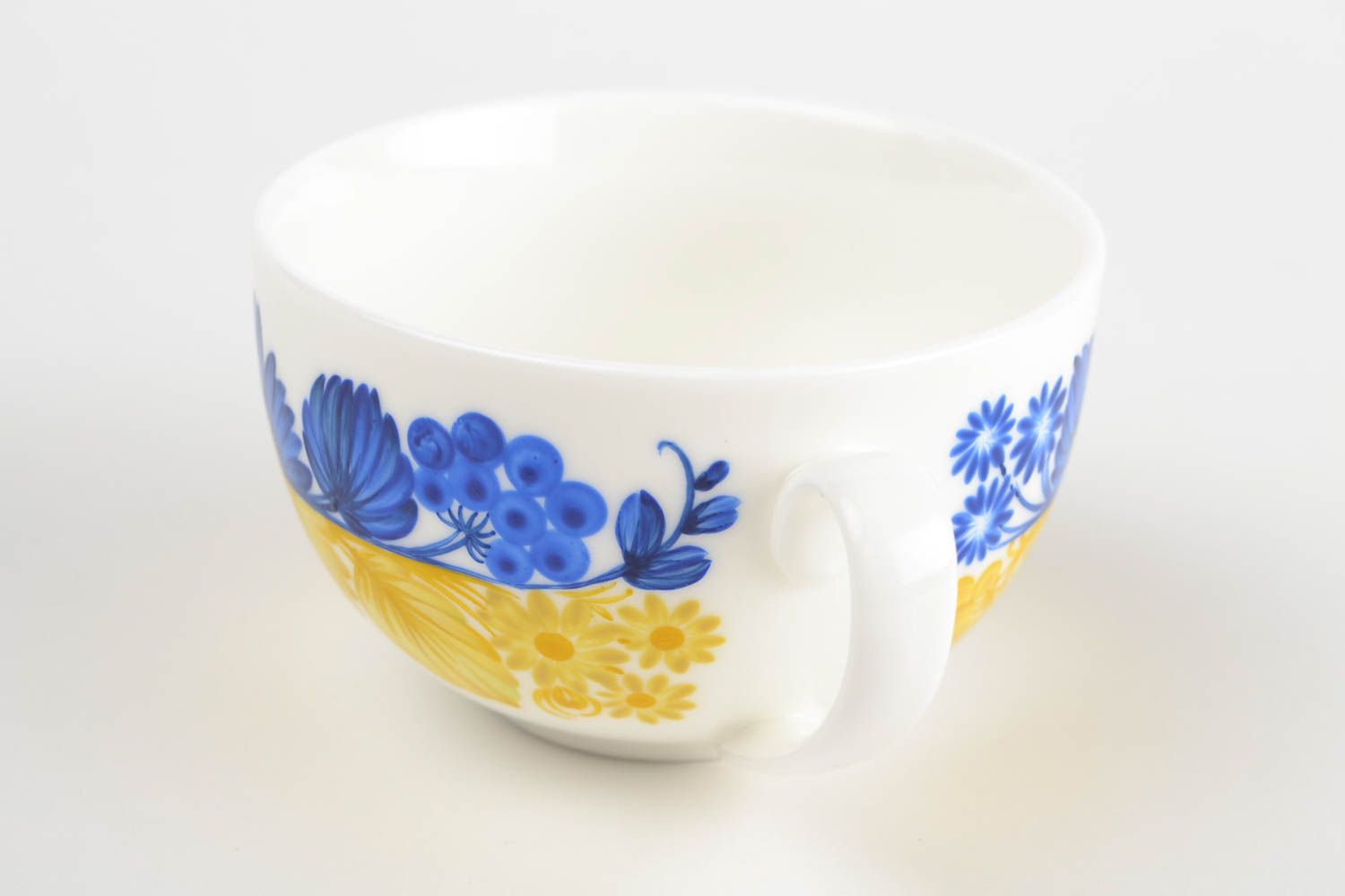 White wide ceramic porcelain cup in blue and yellow color with handle photo 5
