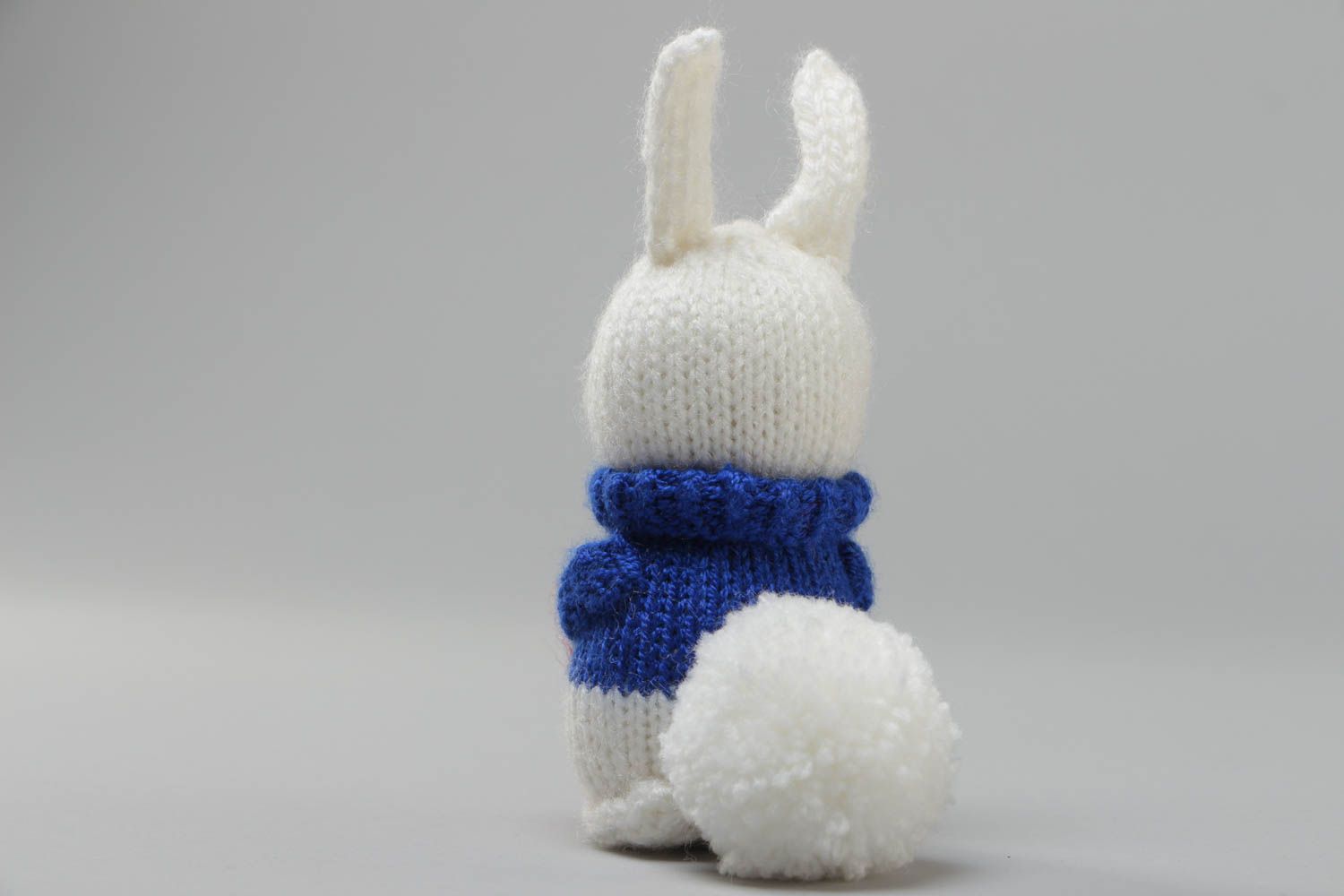 Handmade soft knitted white rabbit toy with a red heart for children photo 4