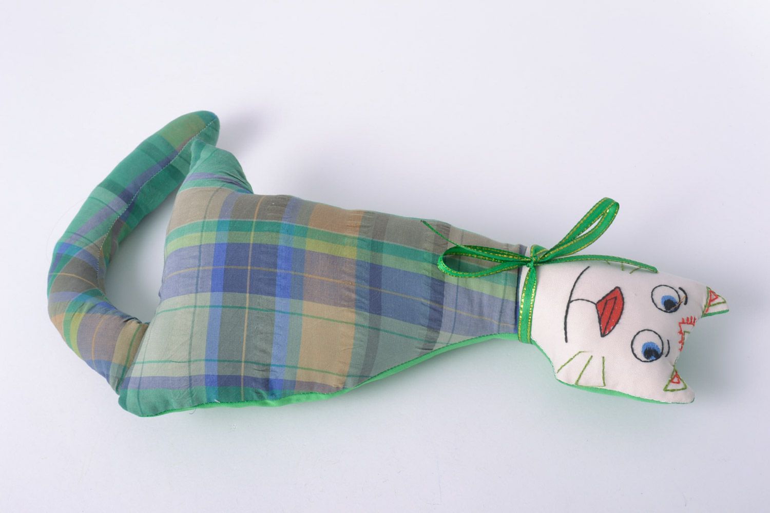 Handmade designer soft toy cat sewn of checkered fabric with green bow  photo 2