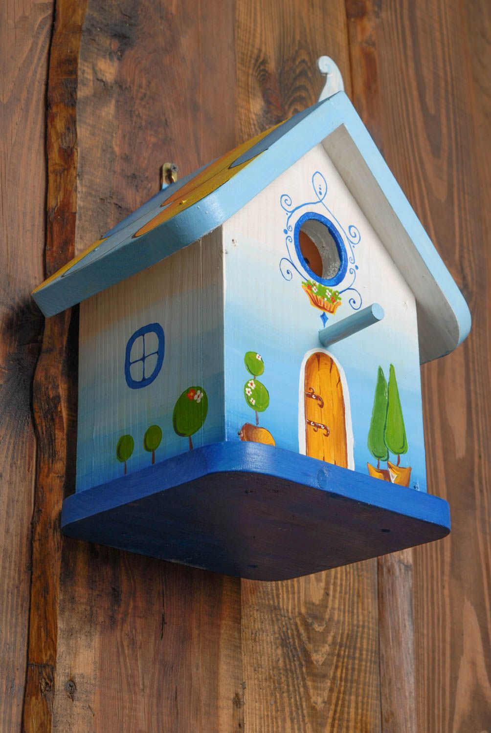 Handmade painted wooden birdhouse in the shape of forest house photo 4