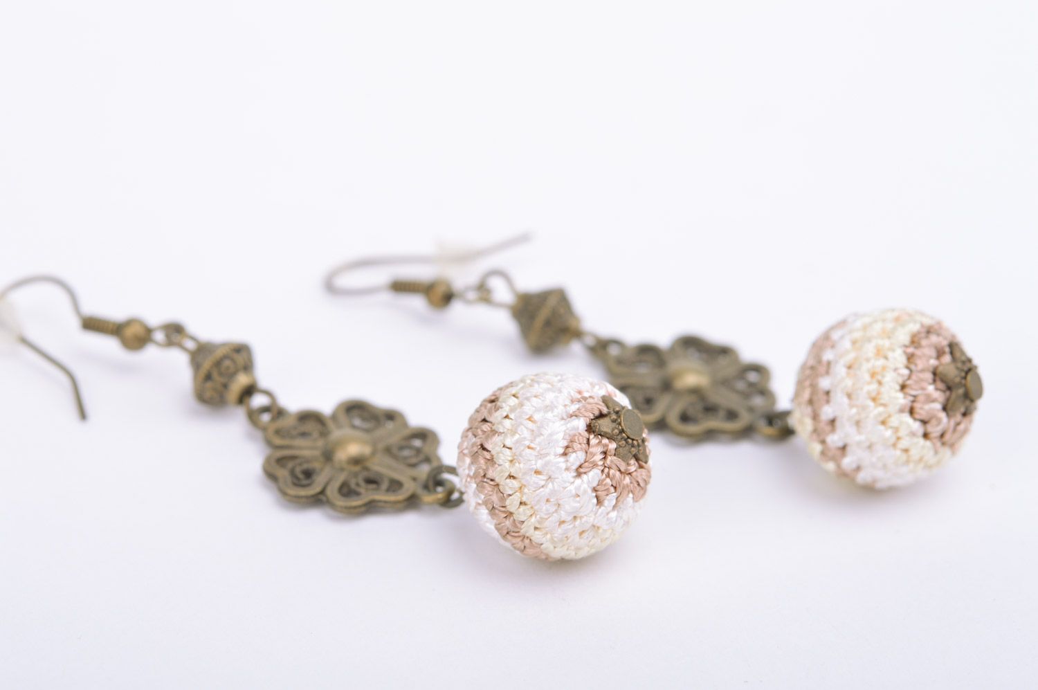 Handmade dangle earrings with metal fittings and light crocheted over beads photo 1