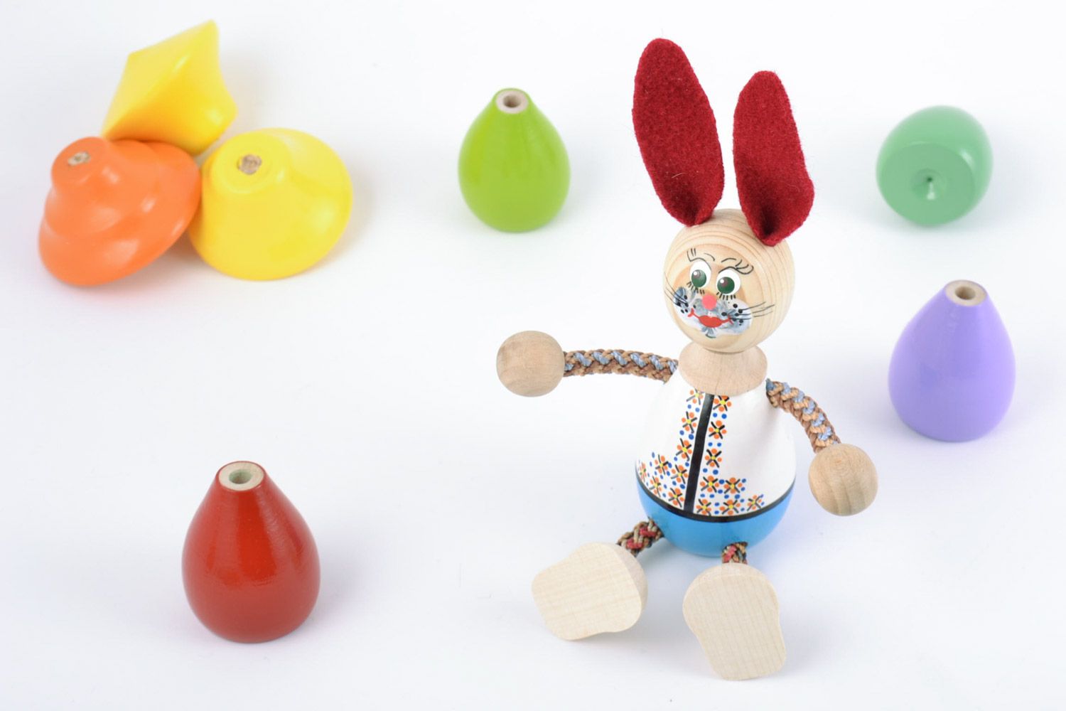 Homemade painted wooden eco toy in the shape of hare for children photo 1